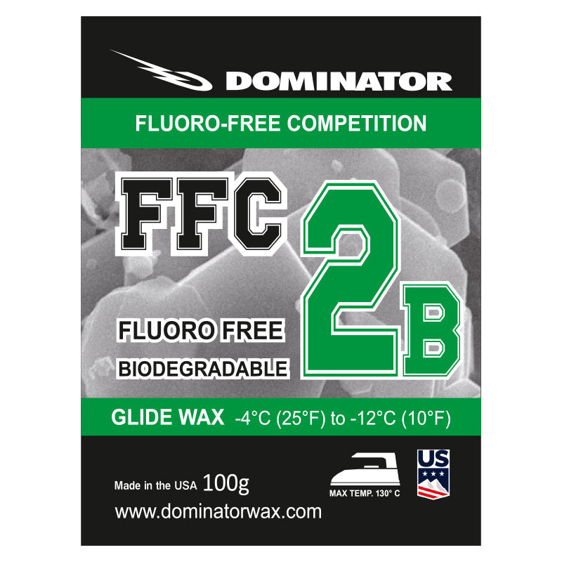 Auf dem Etikett eines Dominator FFC 2B-Gleitwachses steht Fluoro-Free Competition, Fluoro Free Biodegradable, Glide Wax, -4°C (25°F) bis -12°C (10°F), 100g, www.dominatorwax.com, USA.
