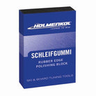 Eine rechteckige blaue Schachtel mit der Aufschrift Holmenkol Schleifgummi der Marke Holmenkol zum Entfernen von Rost und zum Tuning von Ski- und Snowboardkanten. Die Verpackung zeigt weißen und silbernen Text.