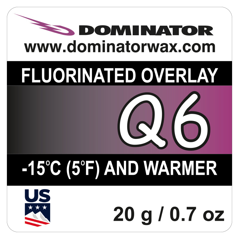 Dominator Q6 Fluorinated Overlay Skiwachs für -15°C (5°F) und wärmer. 20g (0,7 Unzen). Top Speed Leistung. Enthält dominatorwax.com, Dominator-Logo und US-Flaggensymbol.